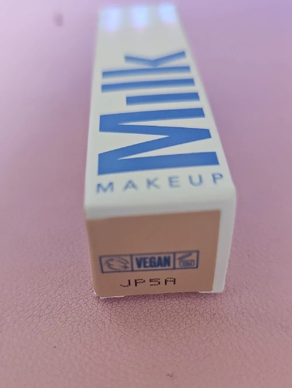 Milk Makeup White Packaging with Bold Blue Logo
